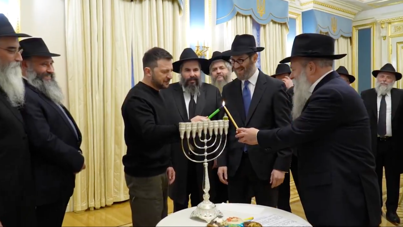 Ukraine’s Volodymyr Zelensky lights a Hanukkah menorah in Kyiv on Dec. 25, 2024. (Screenshot)